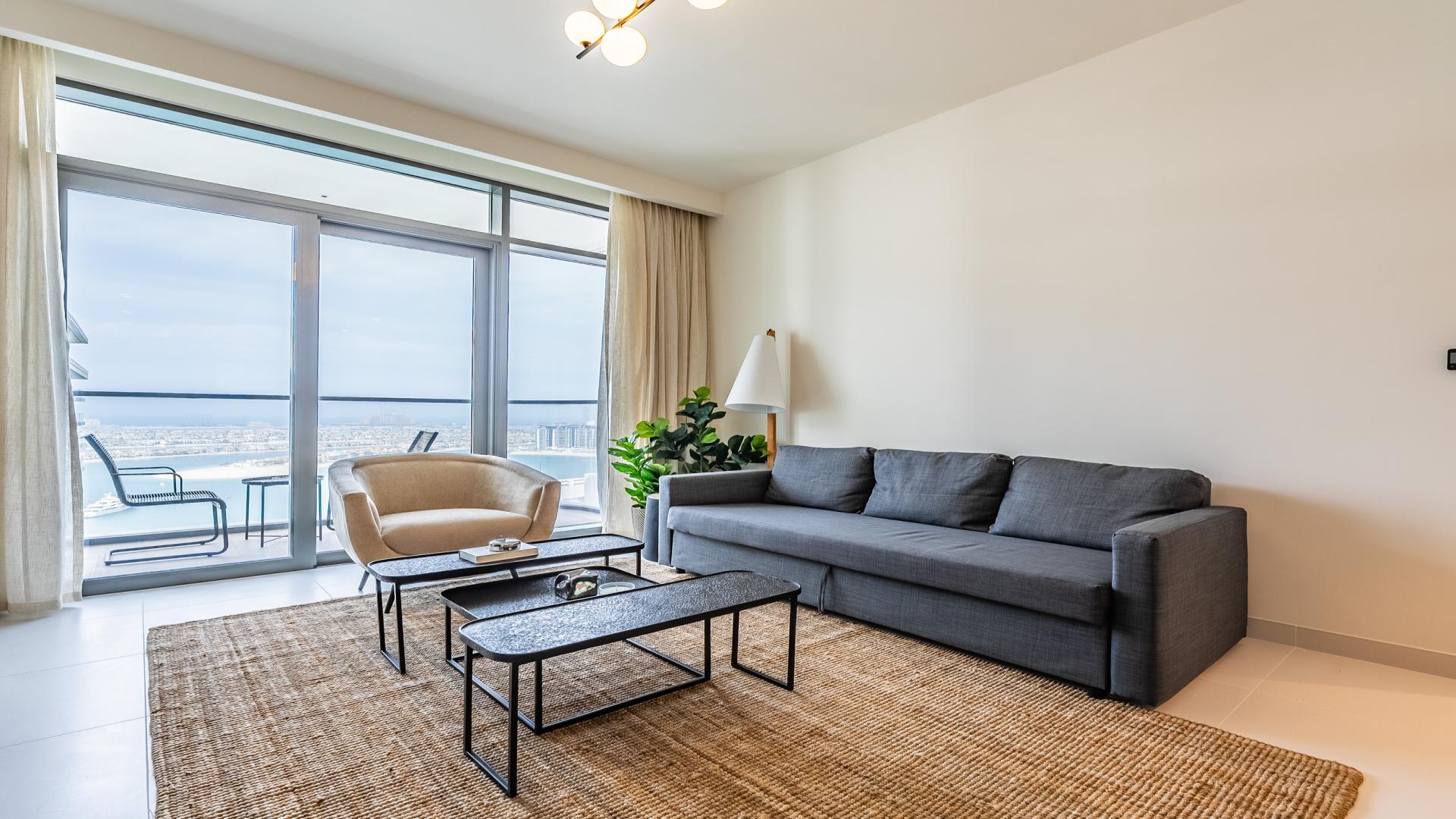 Modern living room with marina view in Dubai Harbour apartment for sale, Emaar Beachfront