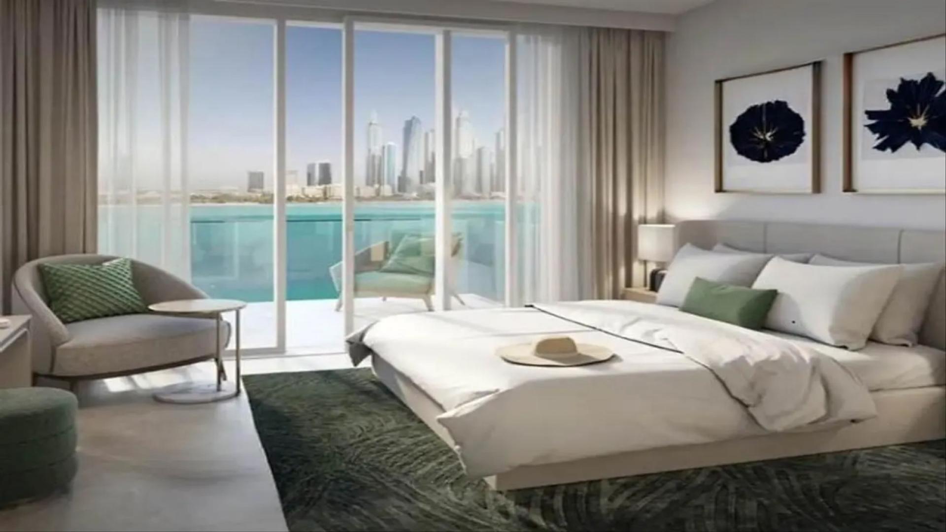 Modern living room in Emaar Beachfront apartment, featuring stylish furniture and sea views