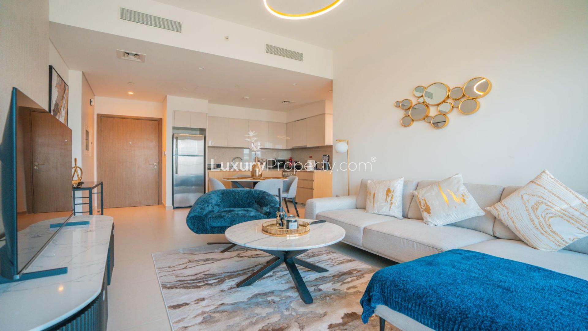 Modern one-bedroom apartment interior in Burj Royale, Downtown Dubai with city view balcony