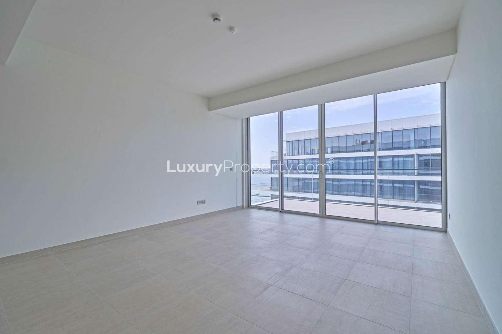 Empty luxury apartment interior with large windows in Serenia Residences, Palm Jumeirah