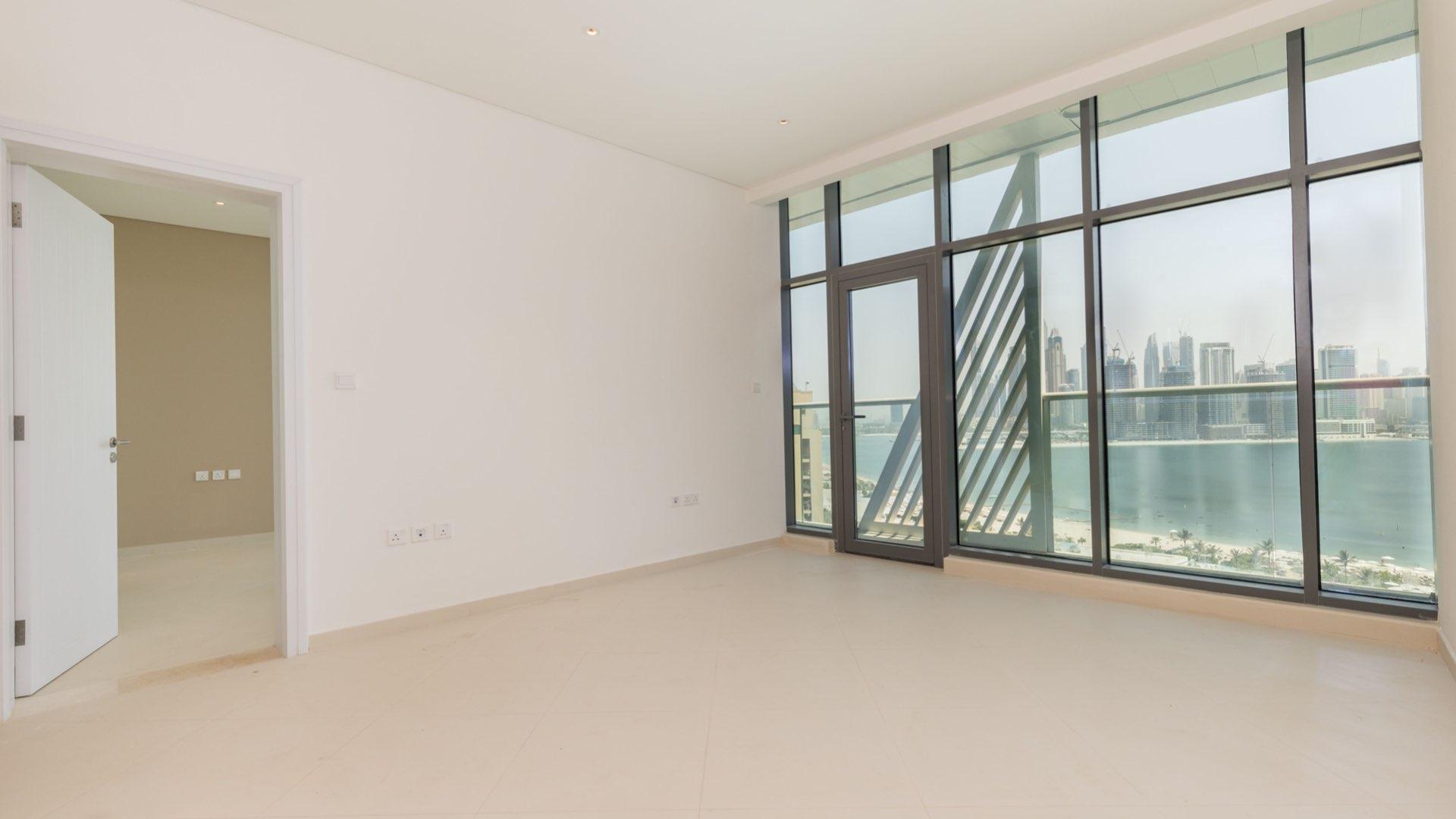 "Stunning sea view from brand new apartment in Seven Palm, Palm Jumeirah, for sale.",Brand new sea-facing apartment interior with large windows in Seven Palm, Palm Jumeirah