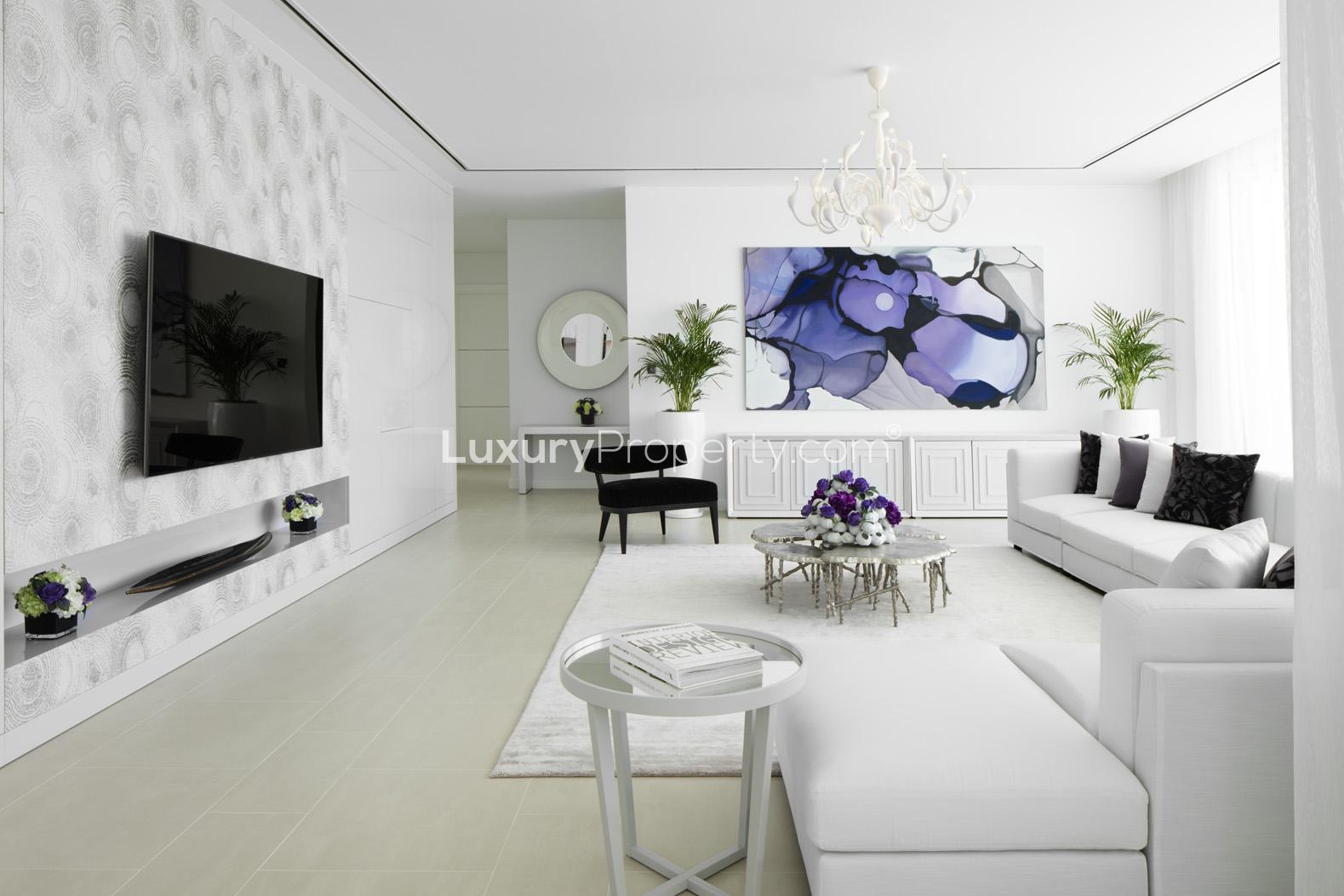 Elegant living room in Al Barari Seventh Heaven apartment with modern decor and chic furniture