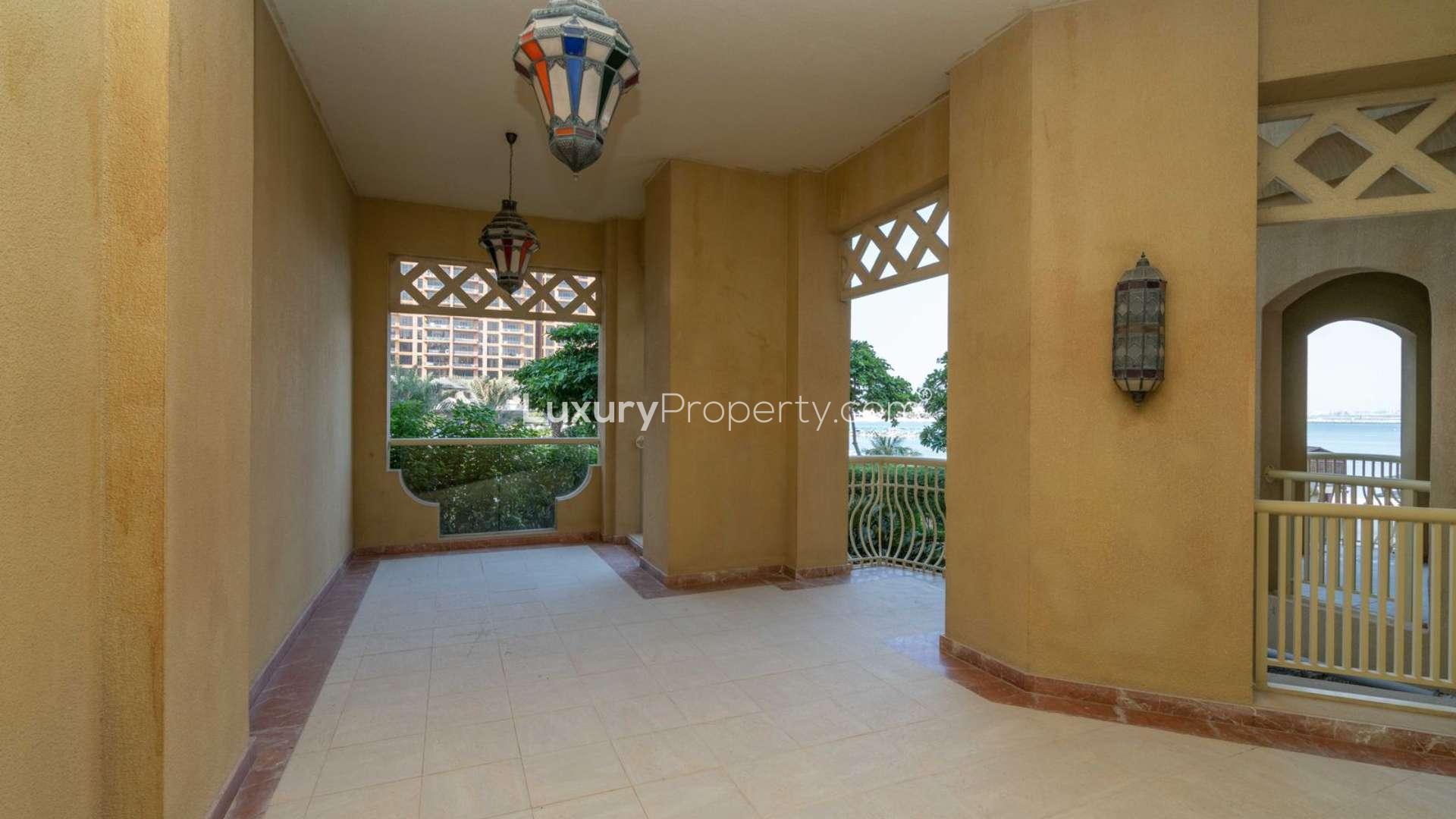 Living room of one-bedroom apartment in Shoreline Residences, Palm Jumeirah, featuring modern decor