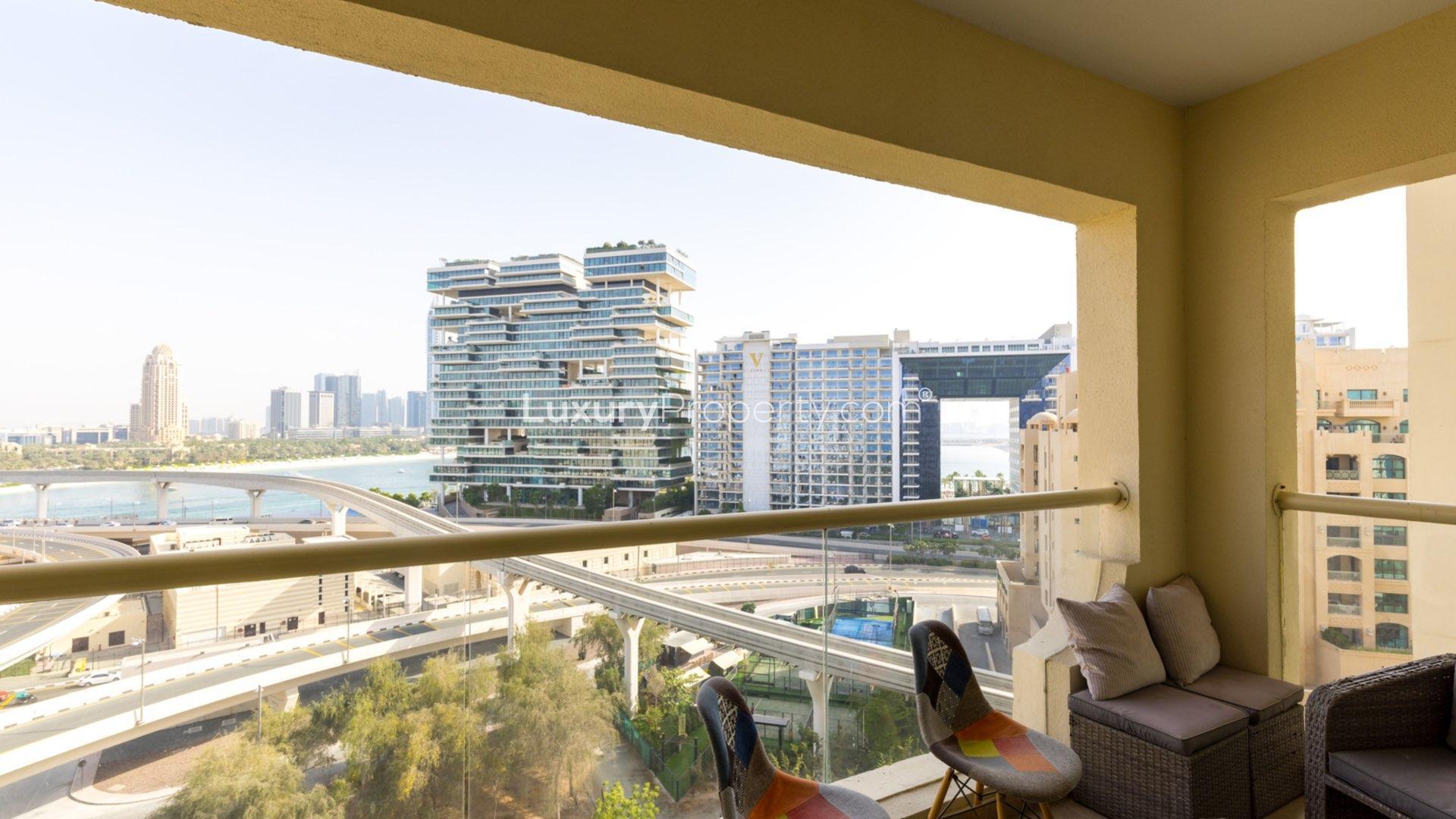 Modern living room with skyline view in Palm Jumeirah apartment for sale