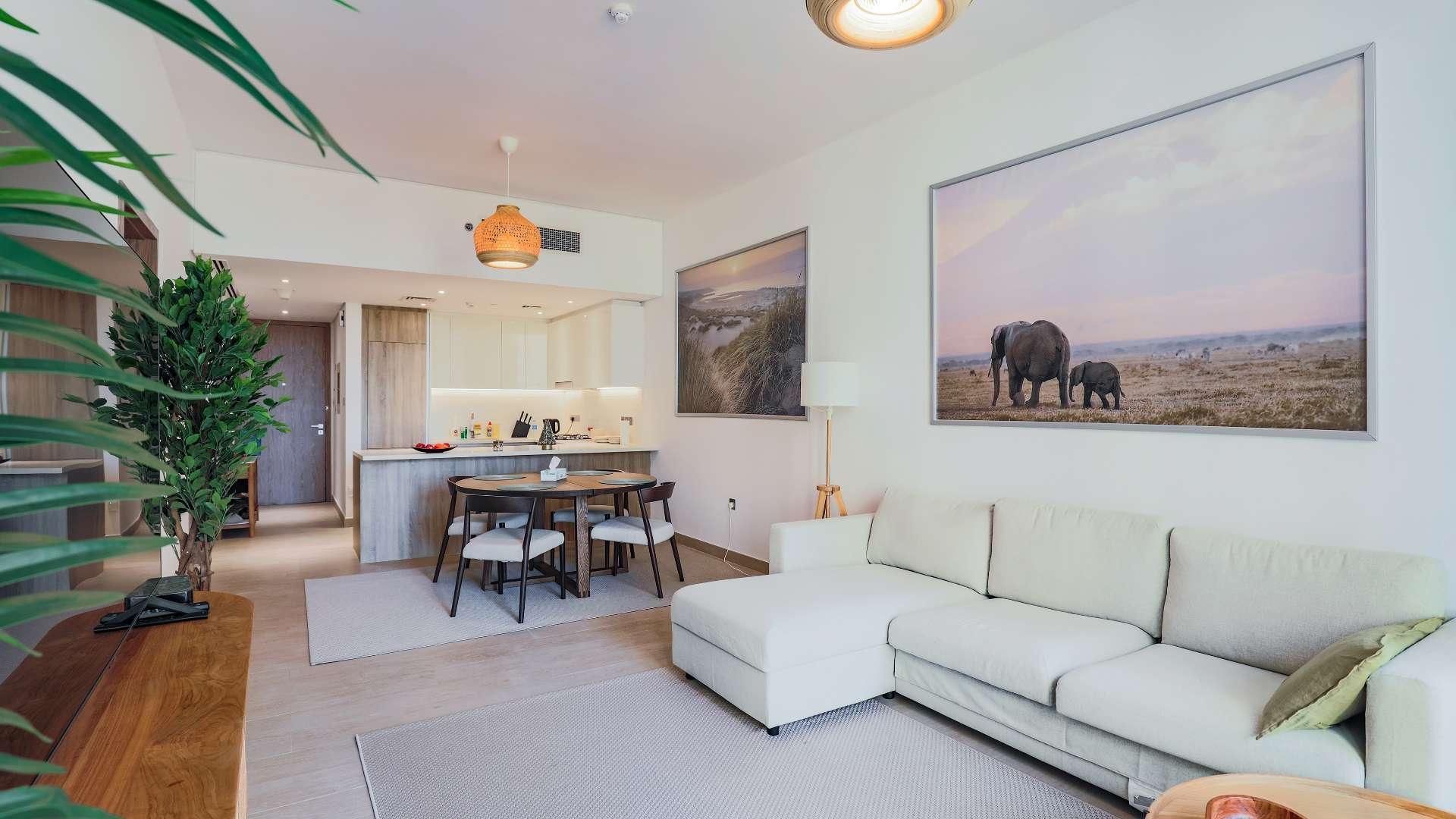 Tall residential buildings in Dubai Marina community near LIV Residence, clear blue sky background