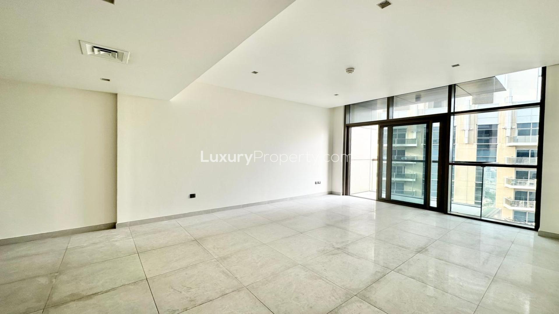 Empty bedroom with wooden built-in wardrobe in No. 9, Dubai Marina apartment for sale