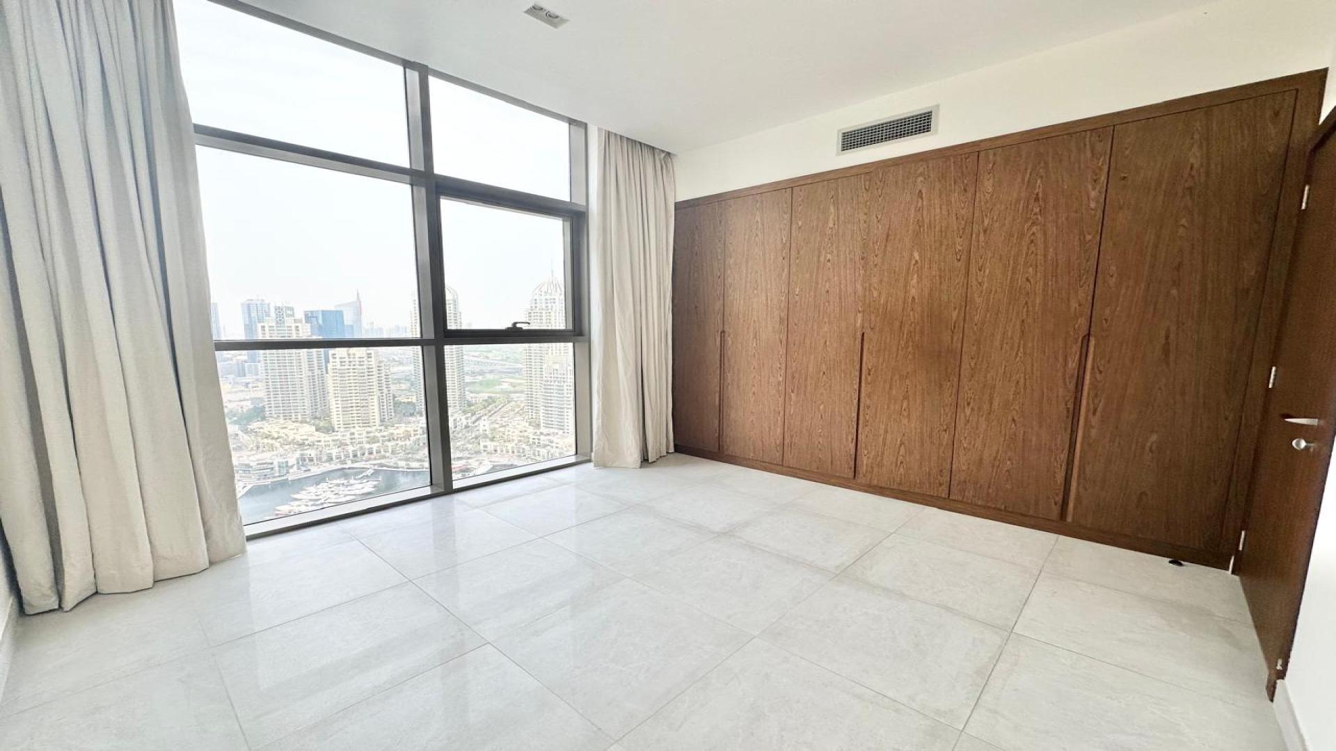Bright living area in No. 9 apartment, Dubai Marina, with large windows and modern design