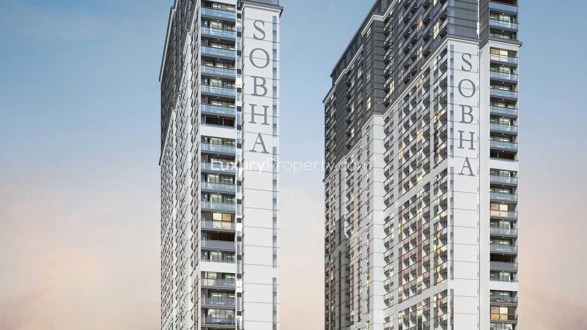 Flamingos in natural habitat with city skyline, near Sobha Hartland, MBR City apartment