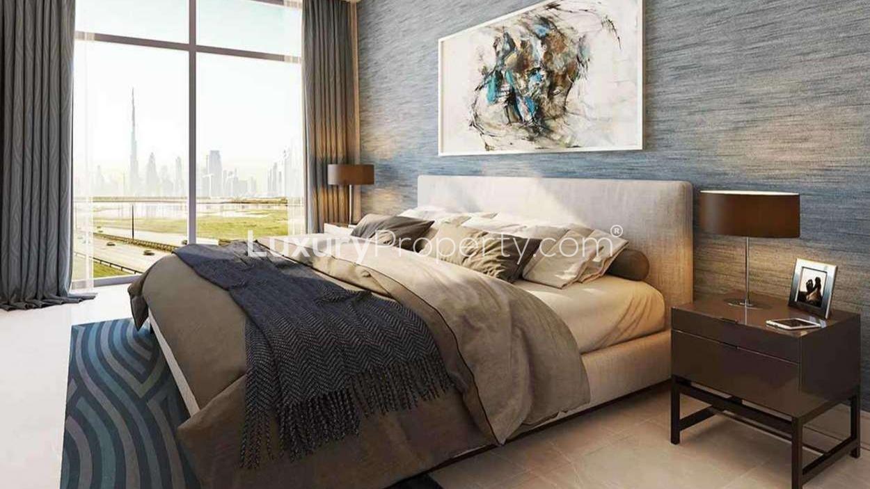 Luxurious pool area at Sobha Creek Reserve apartment, Dubai, with city skyline views