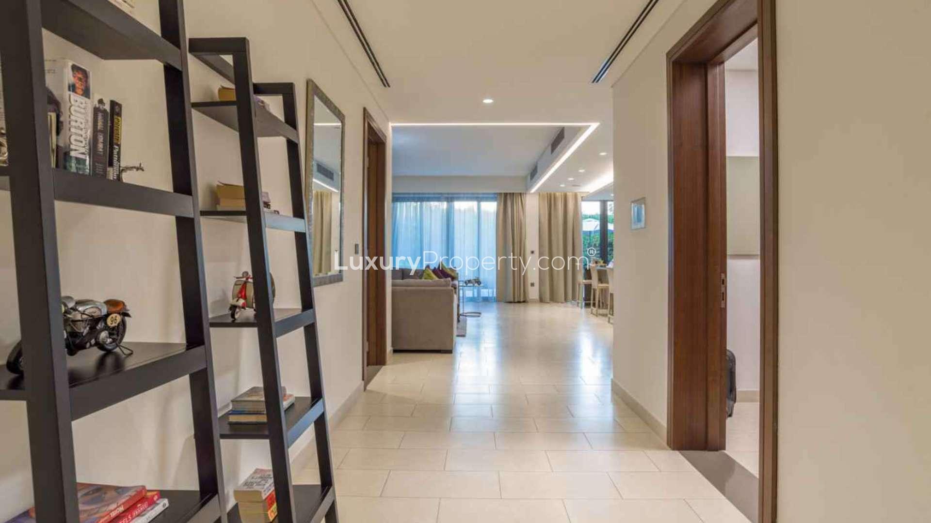 Luxurious bedroom with patio access in Hartland Greens, Mohammed Bin Rashid City apartment