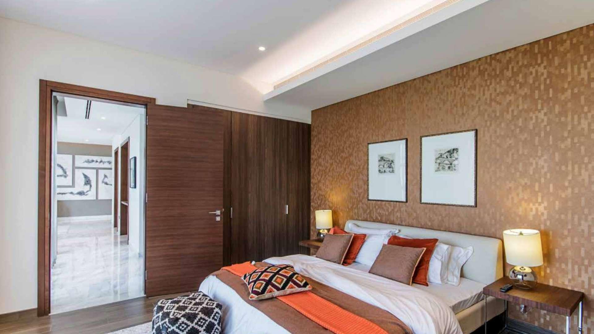 Luxurious bedroom in Sobha Hartland apartment, Mohammed Bin Rashid City, featuring elegant decor