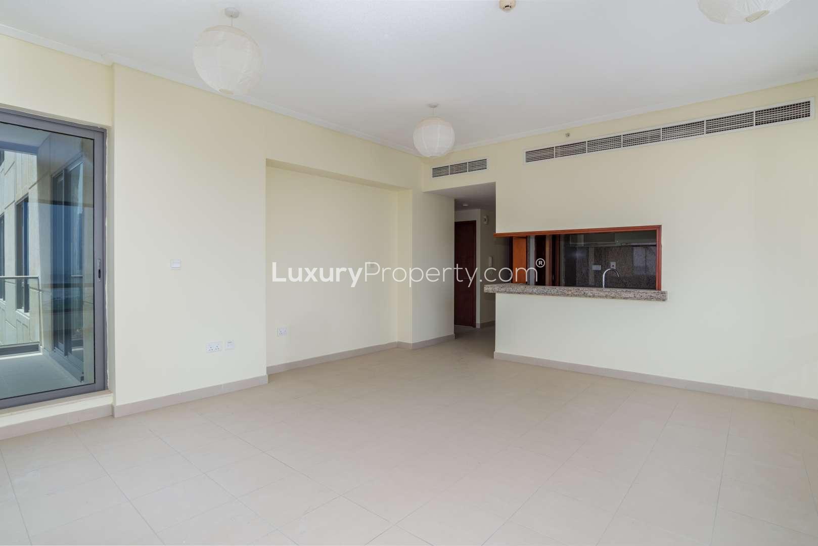 "Balcony view from 1-bedroom apartment in South Ridge Tower 6, Downtown Dubai skyline.",Spacious living area in 1-bedroom apartment, South Ridge Tower 6, Downtown Dubai for rent