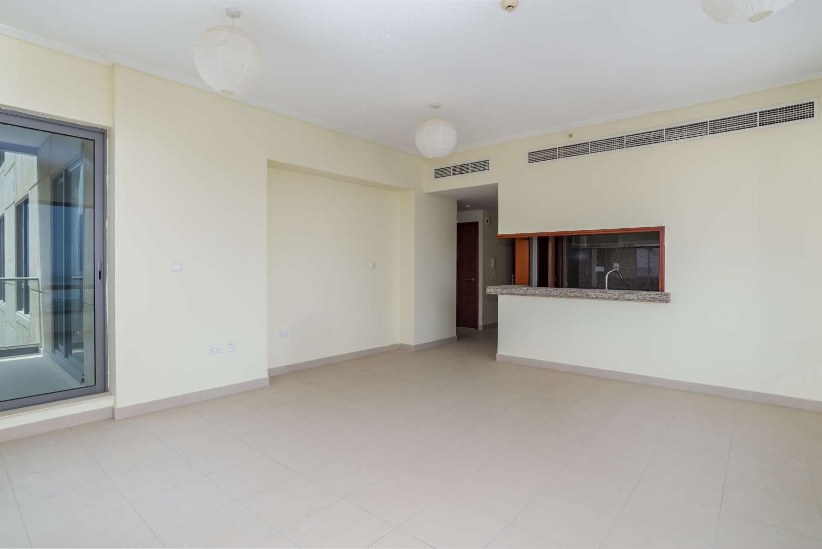 "Balcony view from 1-bedroom apartment in South Ridge Tower 6, Downtown Dubai skyline.",Spacious living area in 1-bedroom apartment, South Ridge Tower 6, Downtown Dubai for rent