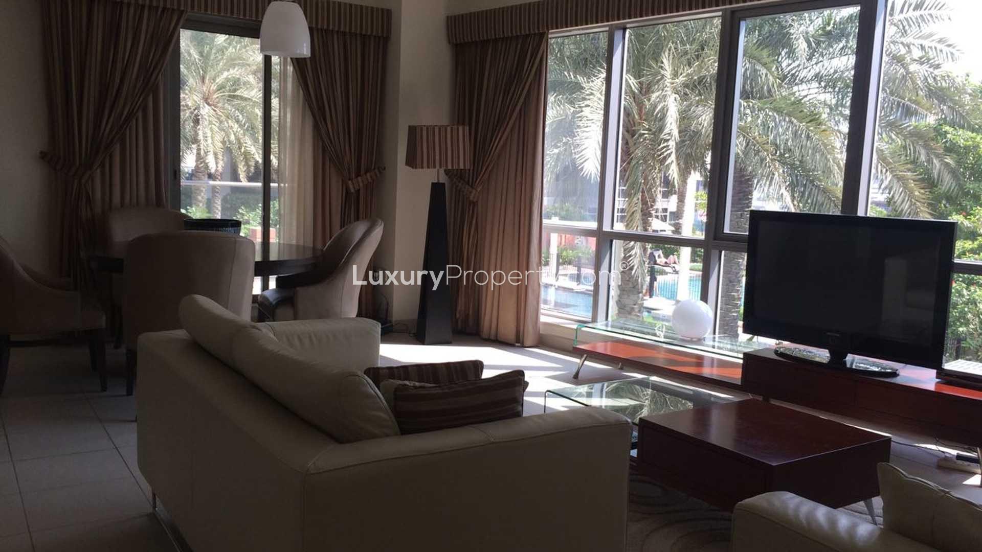 Outdoor pool and lush garden at South Ridge 1 apartment, Downtown Dubai