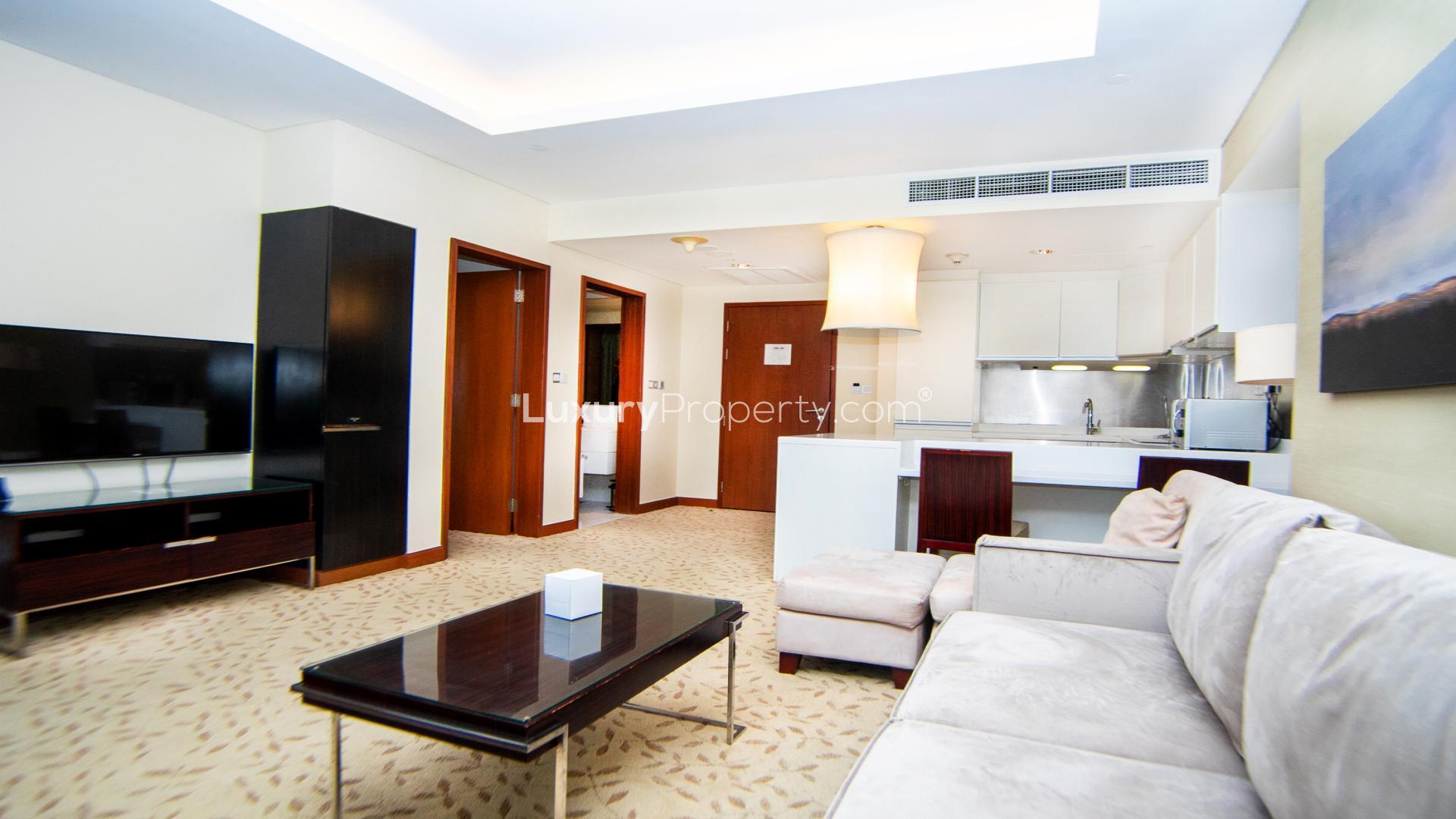 Modern furnished living room with city views in The Address Dubai Mall apartment
