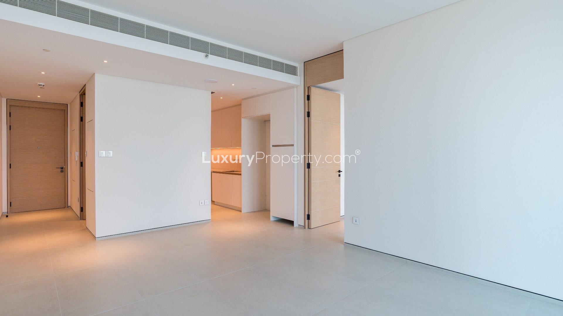 Furnished apartment interior at The Address Jumeirah, open layout, bright lighting, modern design