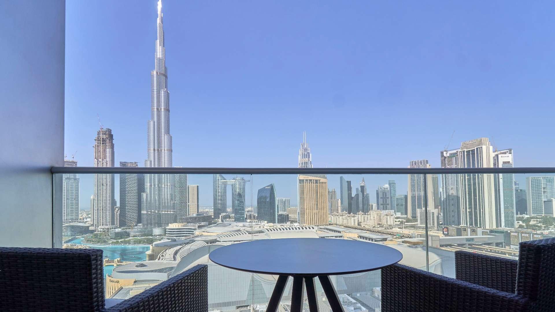 Luxurious Downtown Dubai apartment with Burj Khalifa views from living room, modern decor