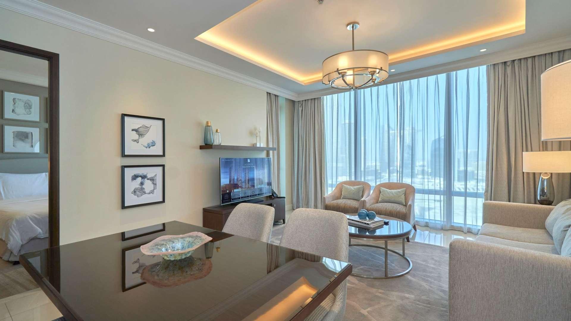 "Balcony view of Burj Khalifa from luxury apartment in Downtown Dubai, The Address Residence.",Luxury apartment living room with Burj Khalifa views, Downtown Dubai, modern decor