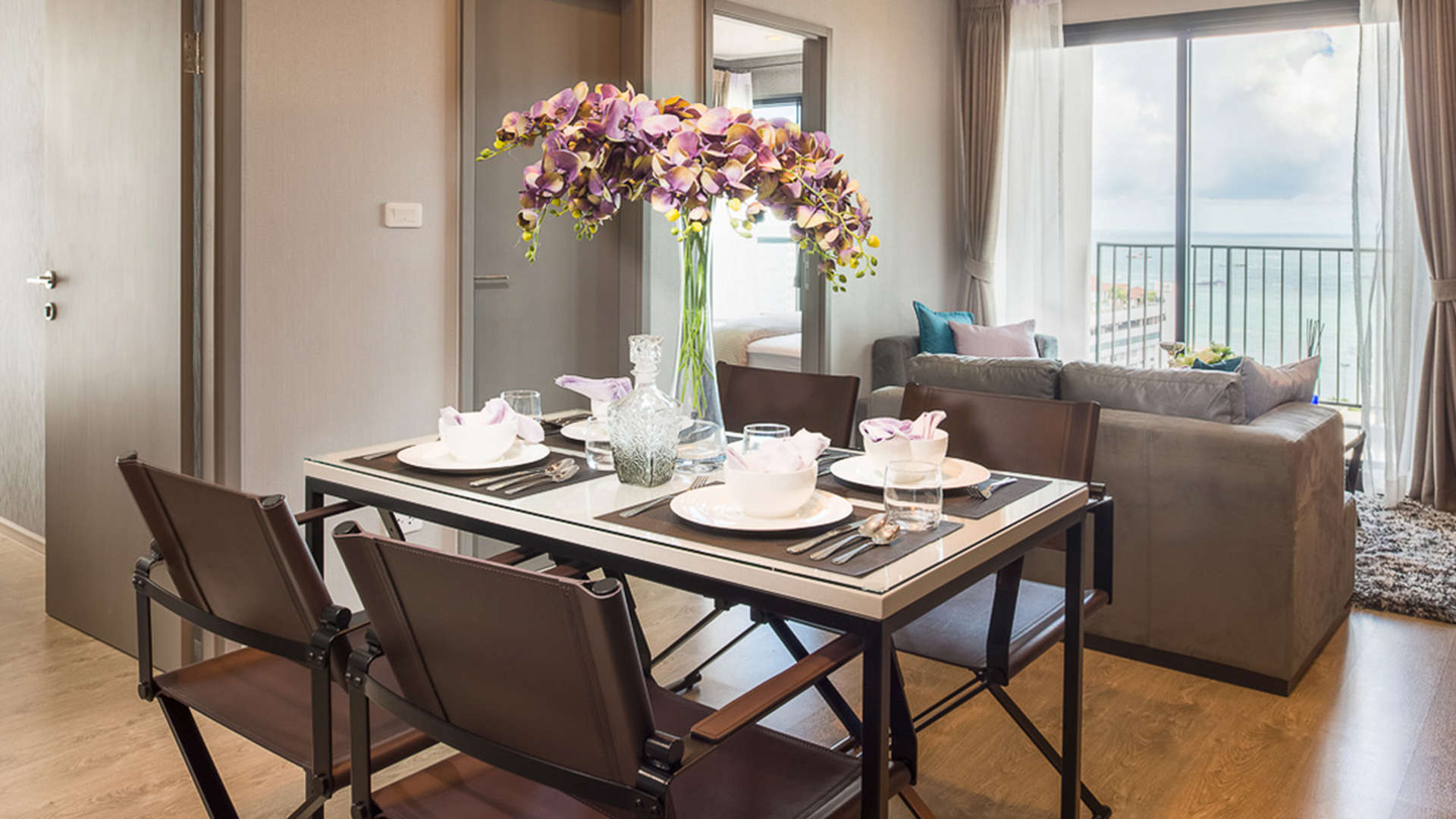 Modern one-bedroom apartment living room with sea view in The Base, Pattaya, Thailand