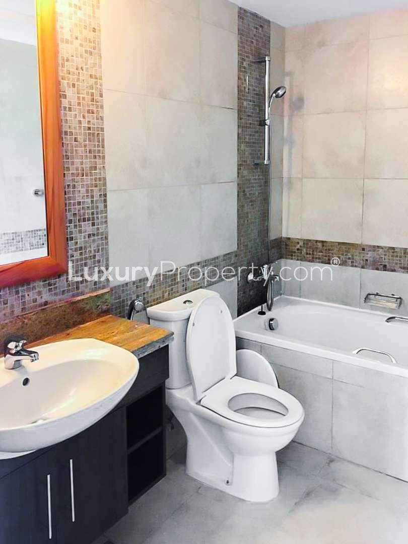 Front-load washing machine in villa closet, The Fairways, The Views, LP09673