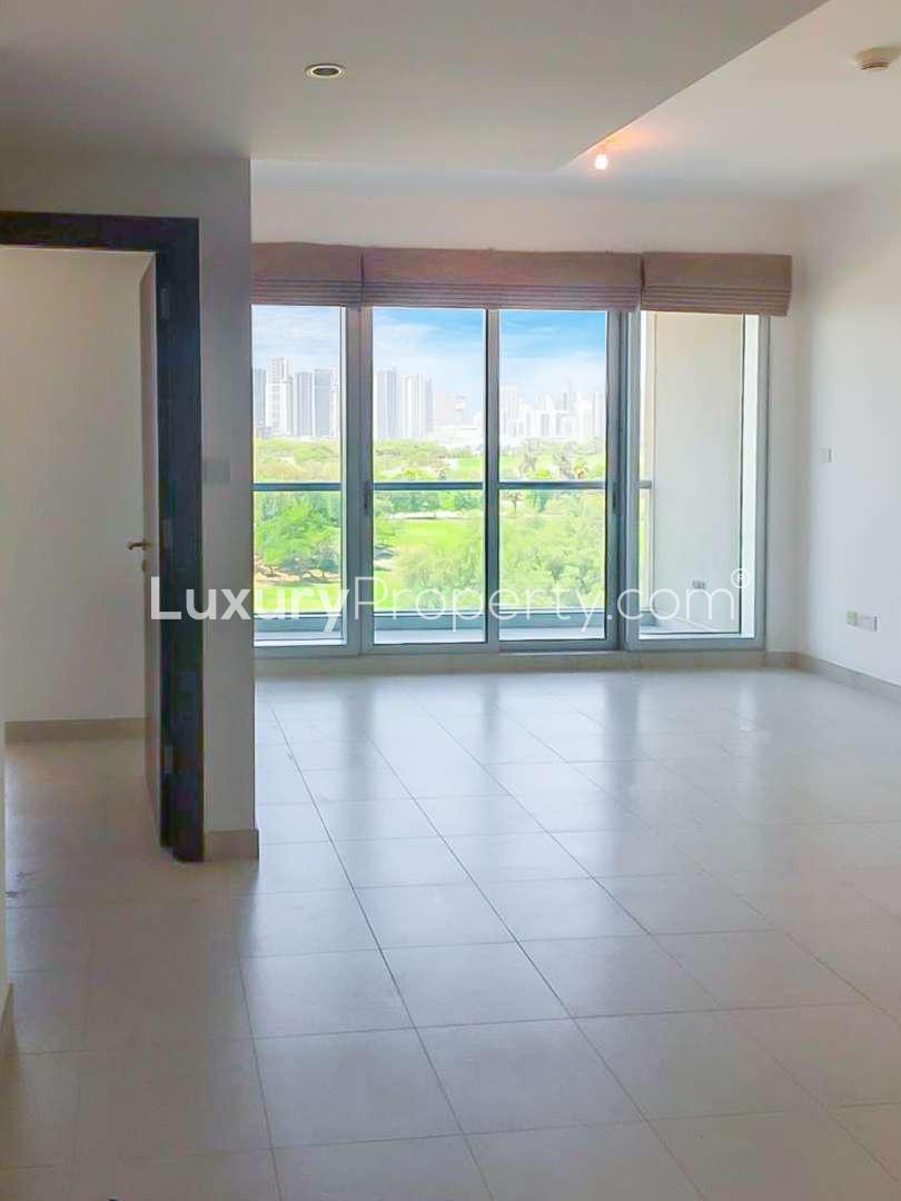 Modern bathroom in The Fairways apartment, featuring elegant tiles and a bathtub
