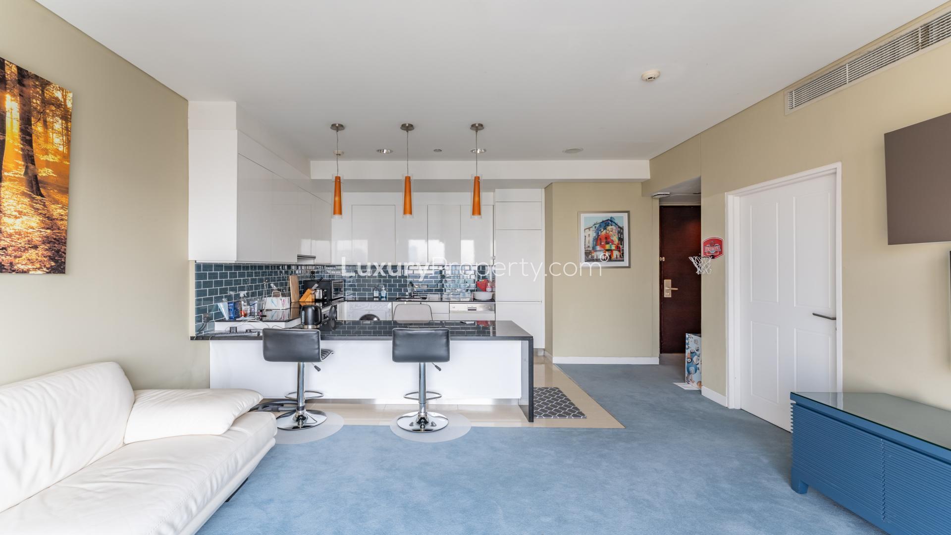 Stylish open-plan kitchen and living area in The Address Dubai Marina apartment for sale