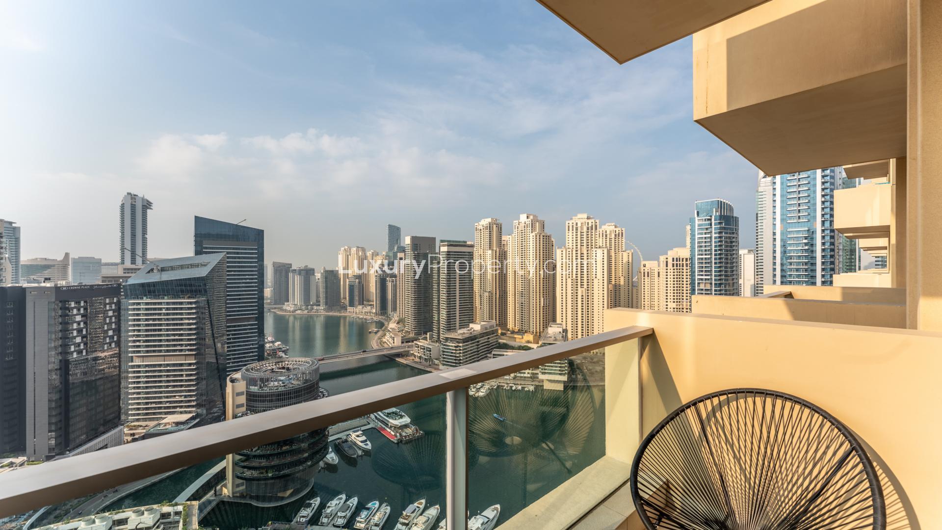 Modern living room with marina view in upgraded Dubai Marina apartment for sale