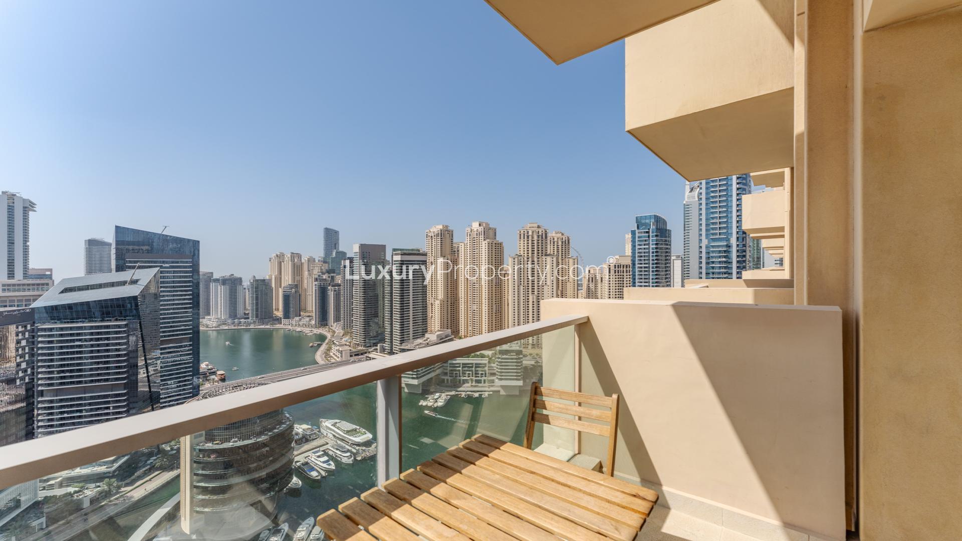 Dubai Marina skyline view from JW Marriott apartment, featuring waterfront and skyscrapers