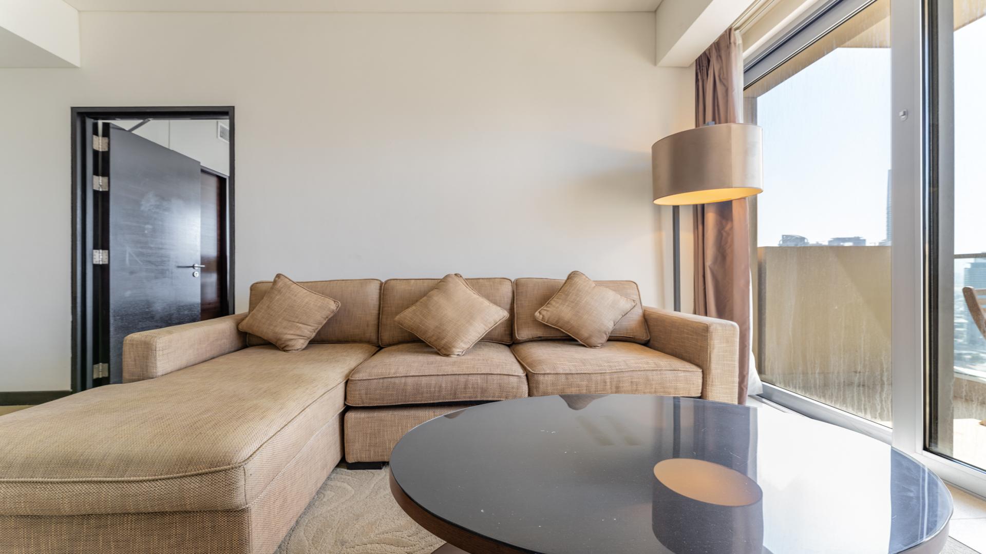 Dubai Marina skyline view from JW Marriott apartment, showcasing waterfront and skyscrapers