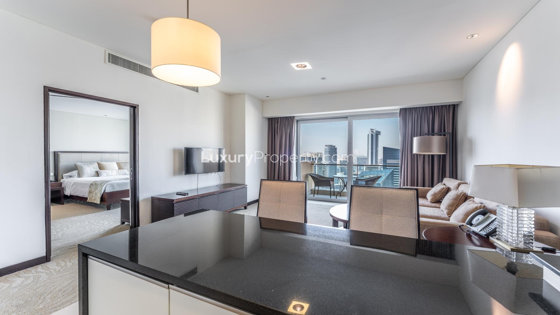 Balcony view of Dubai Marina from The Address apartment, showcasing stunning waterfront skyline