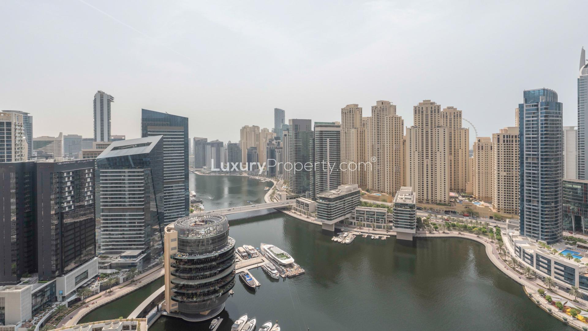 Modern kitchen and living area with panoramic marina views in Dubai Marina apartment