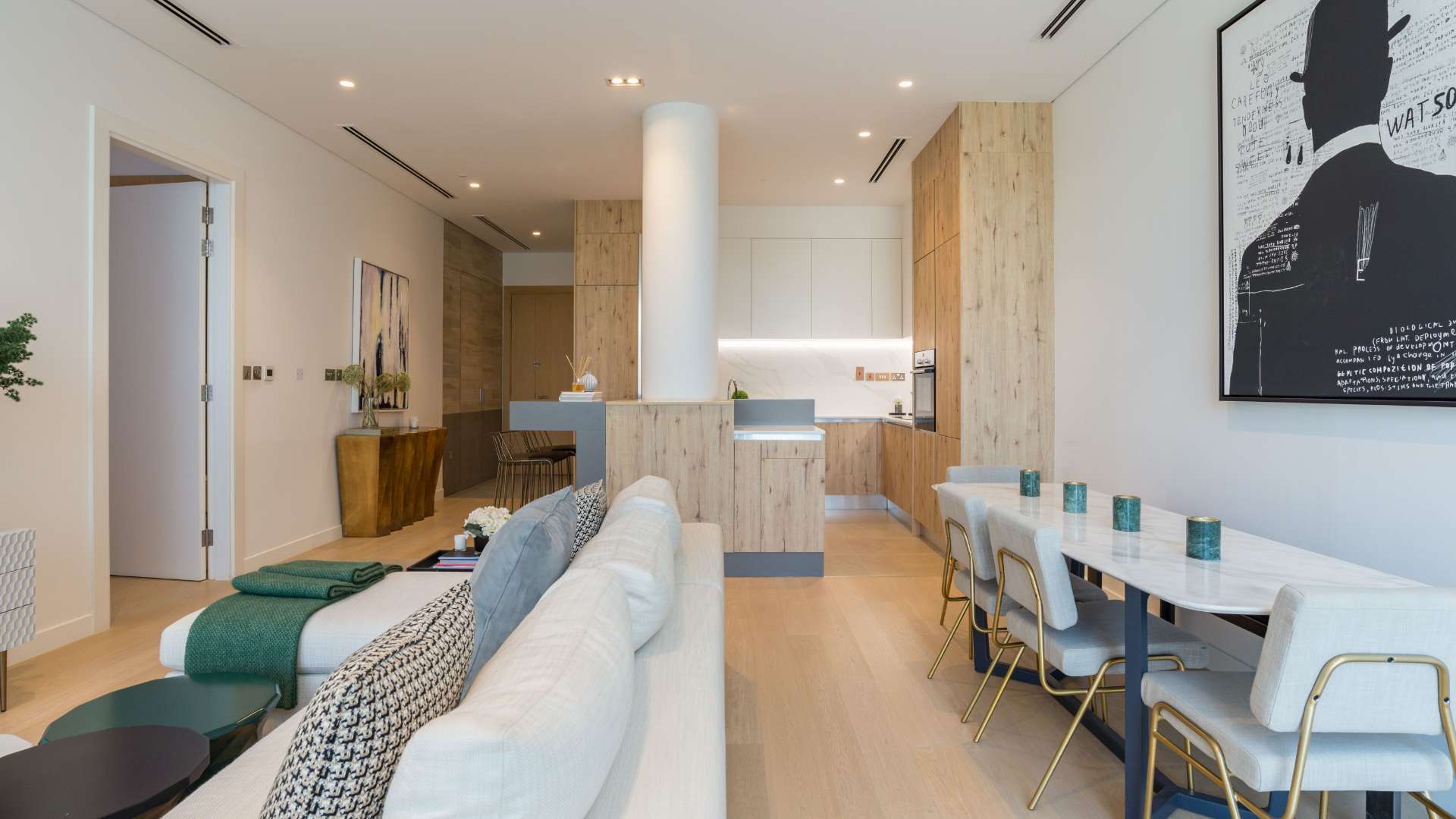 Modern kitchen in Al Barari duplex apartment with wood cabinets and marble countertops