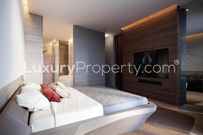 Rooftop pool area at The Opus, Business Bay, with city skyline views and modern design