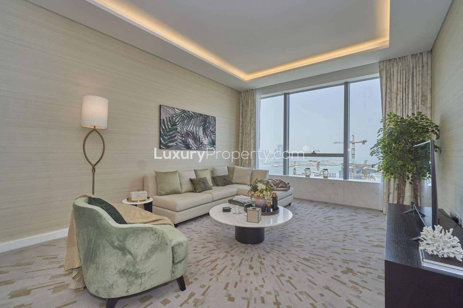"Stunning Palm Tower apartment exterior view, Palm Jumeirah, available for sale, sea views.",Furnished living room with sea views in Palm Jumeirah apartment, The Palm Tower