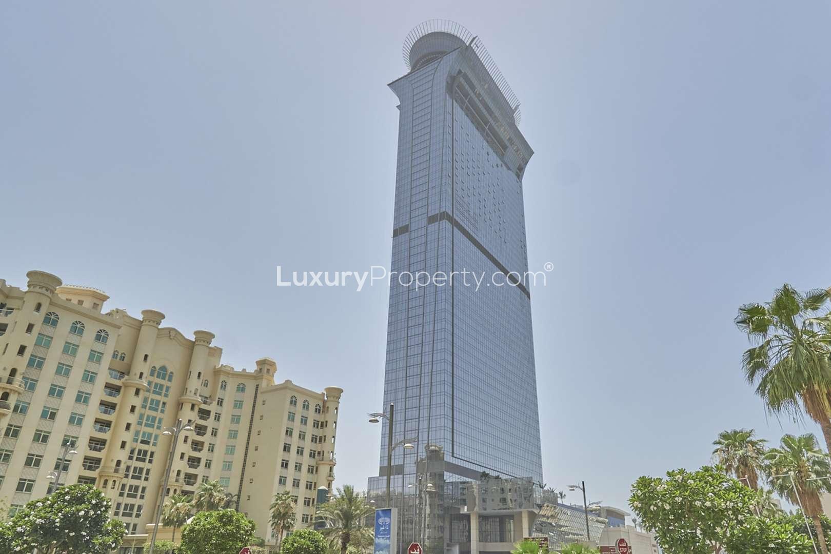 Modern kitchen in Palm Jumeirah apartment, featuring sleek design and stylish breakfast bar