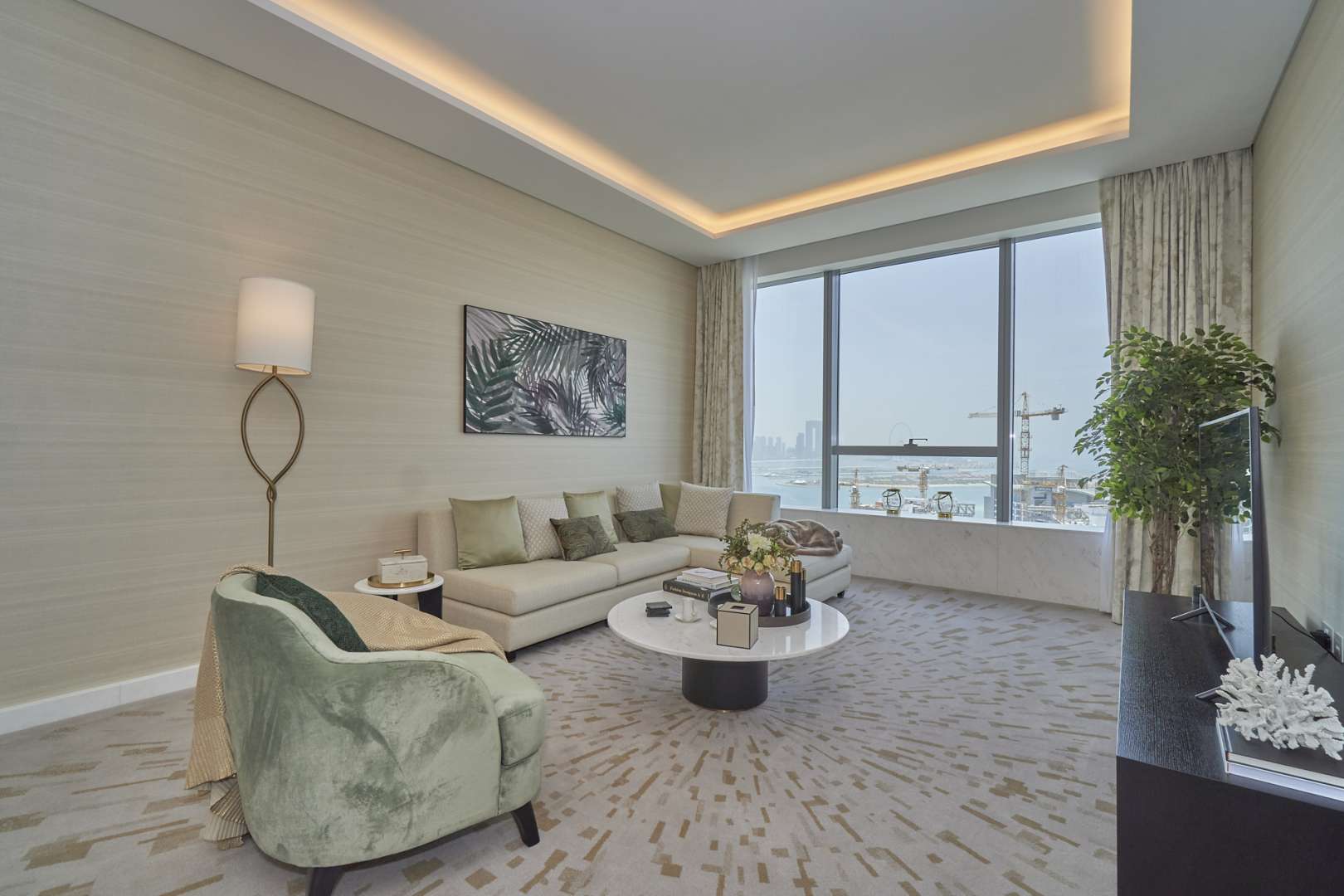 Modern living room in Palm Jumeirah apartment, featuring elegant decor and open kitchen layout
