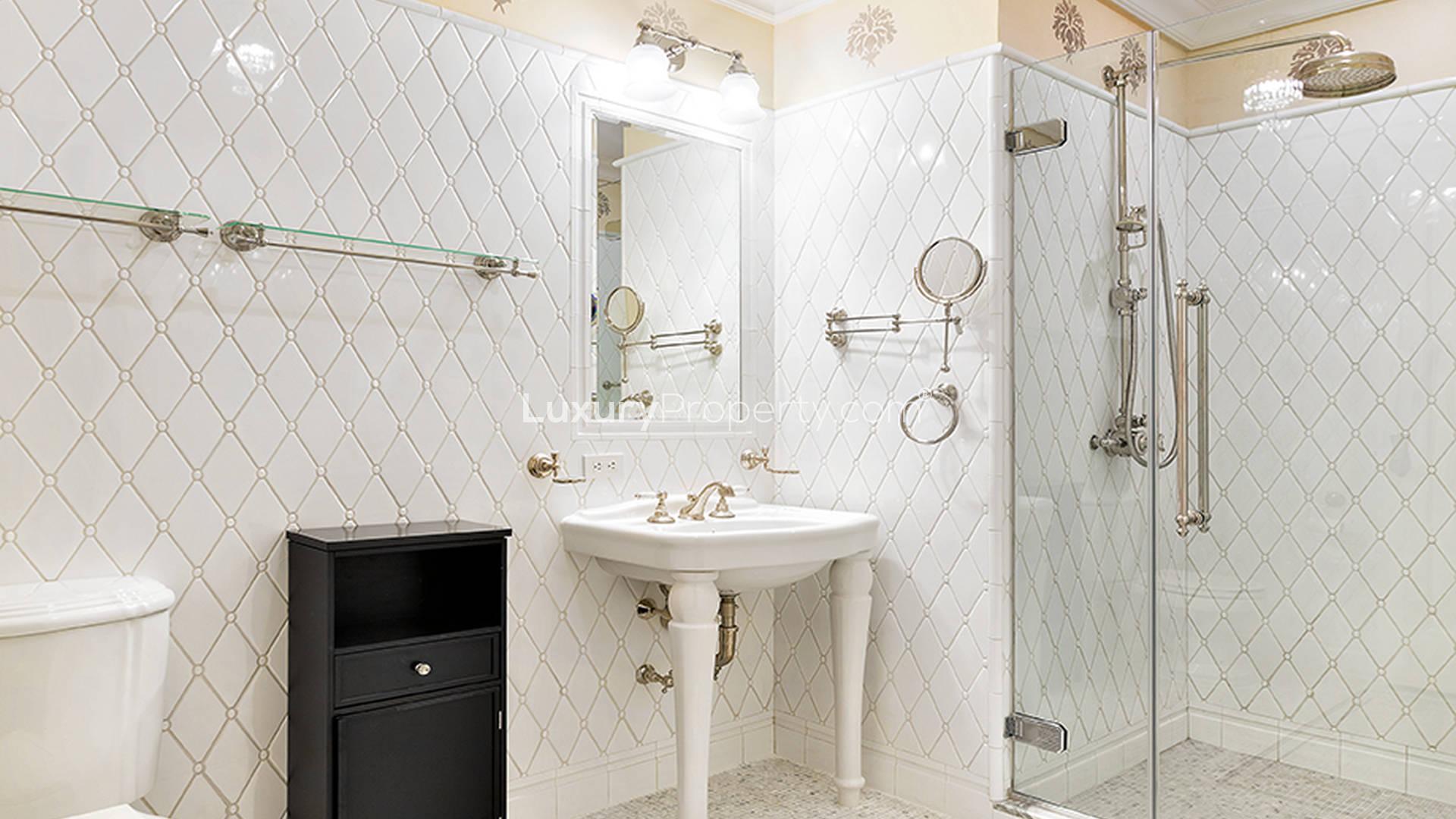 Luxury Manhattan apartment bedroom with elegant decor, plush bed, and natural light