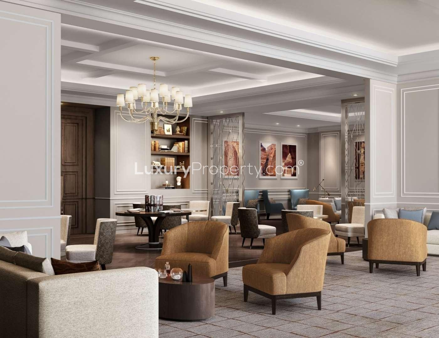 Luxurious lobby interior at The Ritz-Carlton Residences, Amman, featuring elegant chandeliers and decor