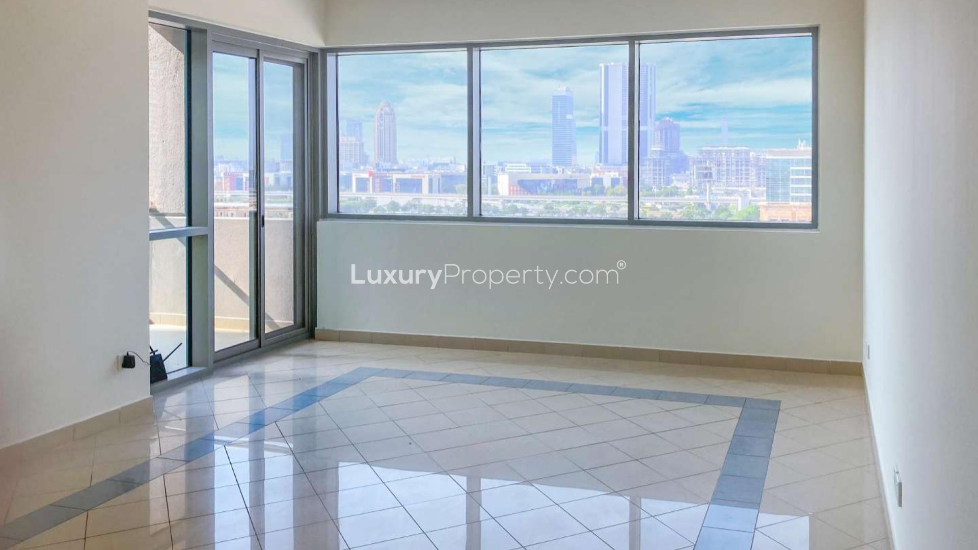 Aerial view of lush golf course near Golf Tower 2, The Views community skyline backdrop