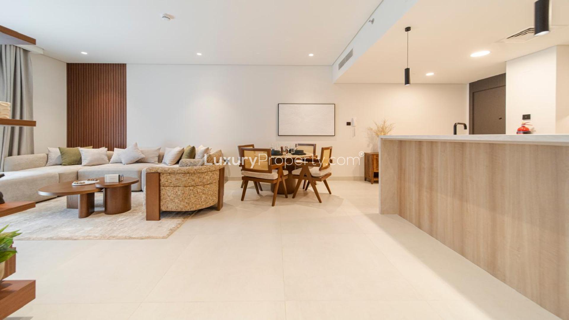 Modern living room in JVT Milestone Residences apartment, featuring cozy seating and stylish decor