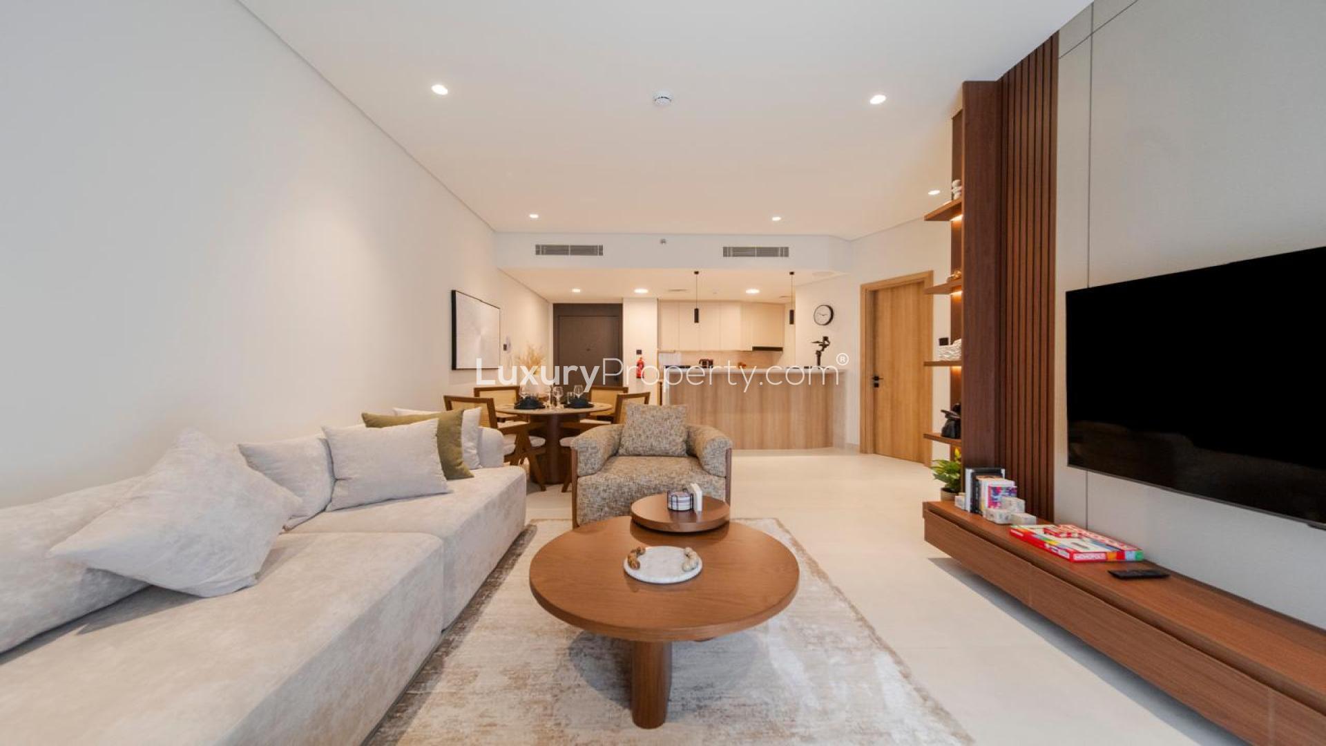 Modern open-plan kitchen and dining area in JVT Milestone Residences apartment for sale