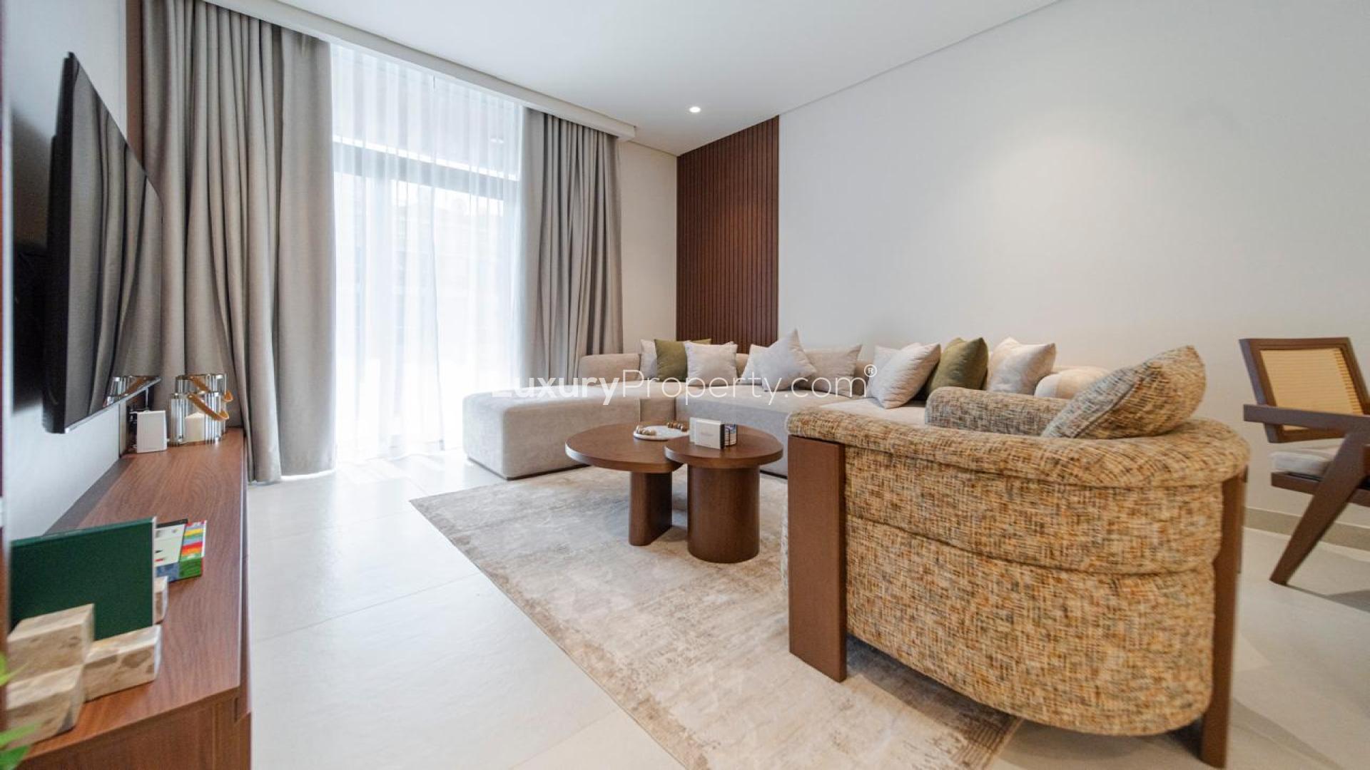 Modern living room and dining area in JVT Milestone Residences apartment for sale
