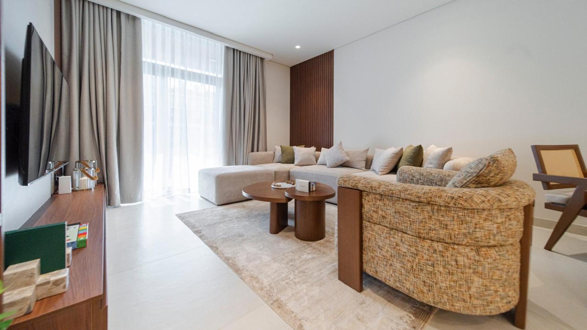 Modern living room and dining area in JVT Milestone Residences apartment for sale