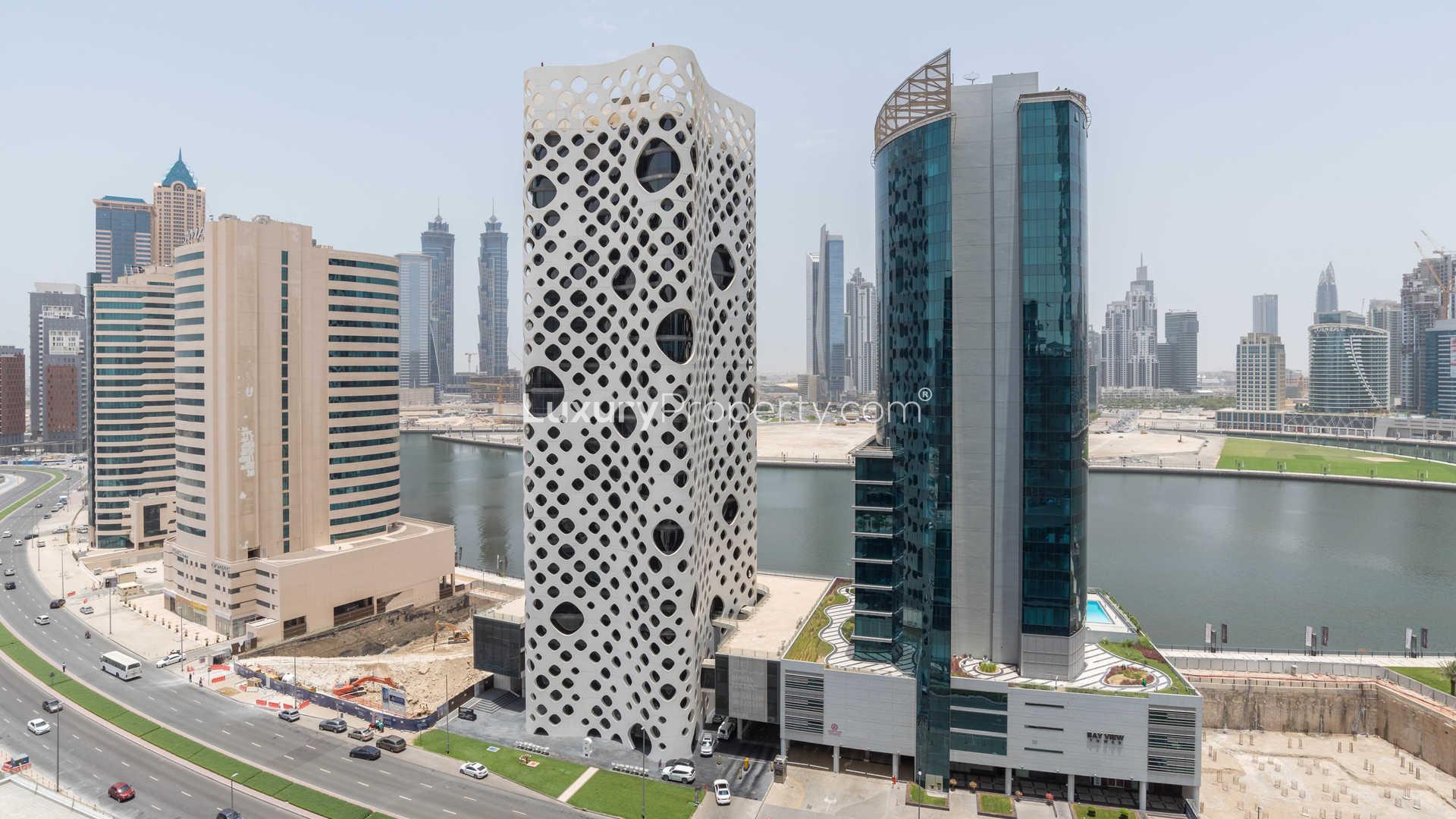 Ultra modern living room in one-bedroom apartment, Ubora Tower, with stylish decor and artwork