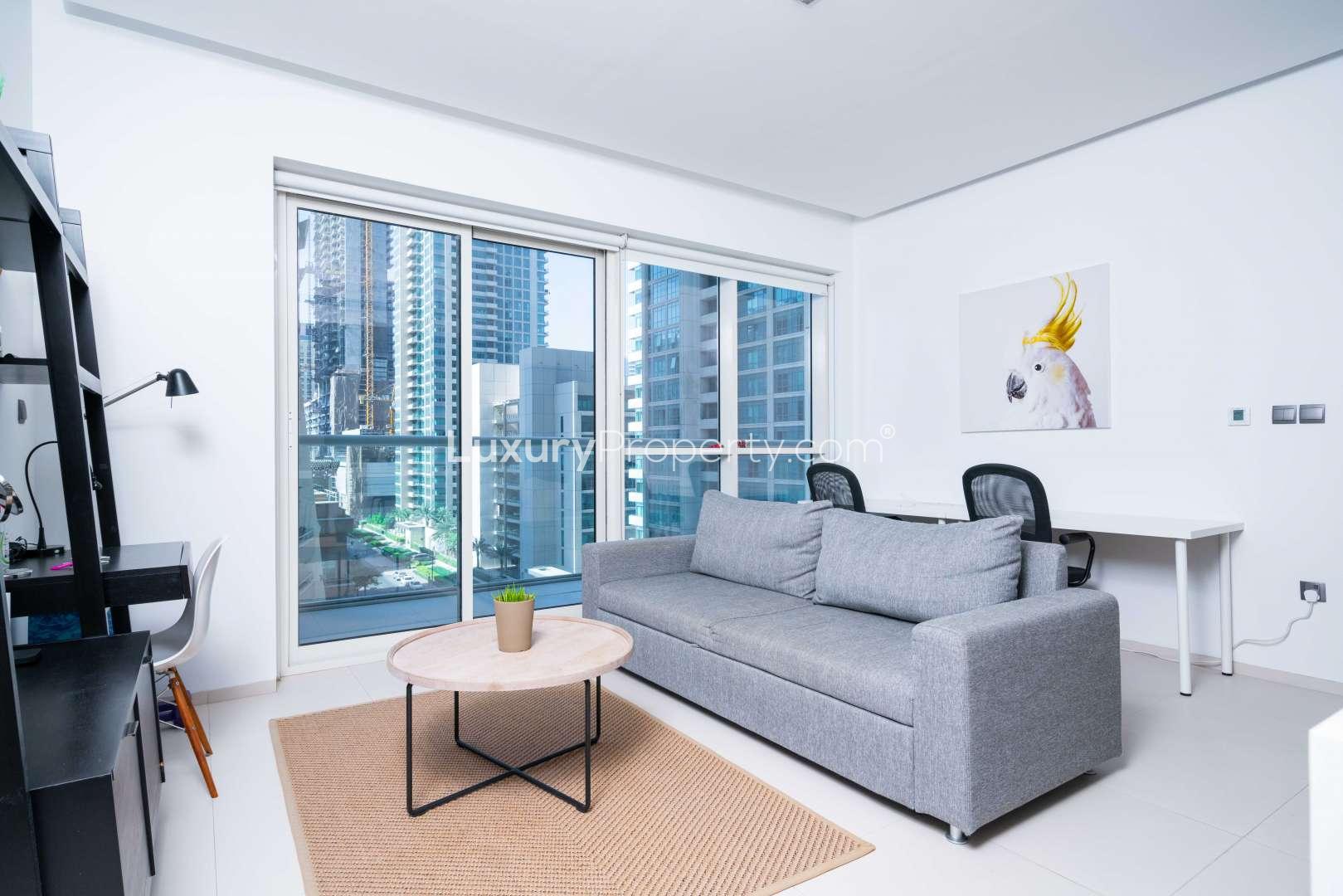 Modern living room in West Avenue Tower apartment, Dubai Marina, with city views