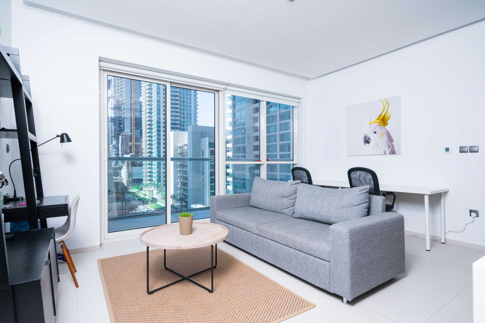 Modern living room in West Avenue Tower apartment, Dubai Marina, with city views