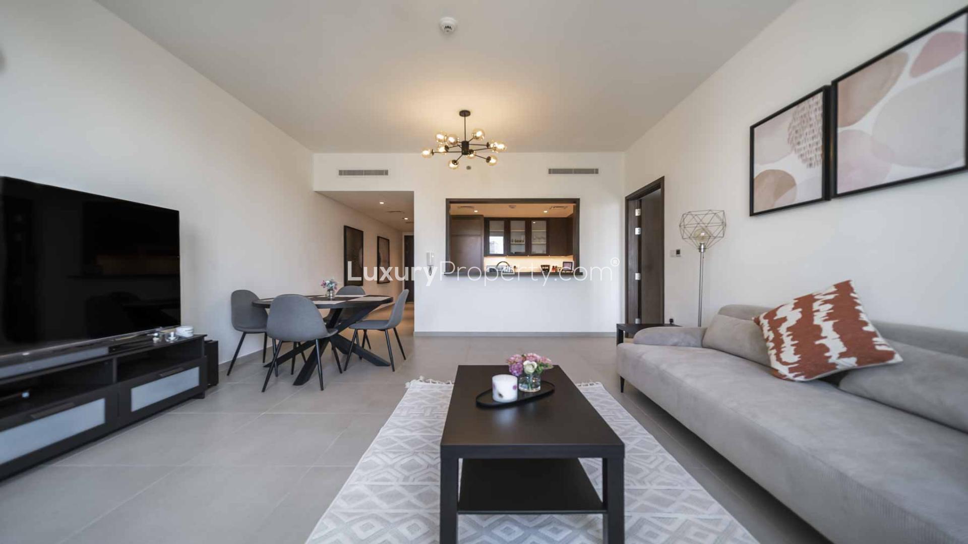 Modern living room in BLVD Heights apartment, Downtown Dubai, featuring stylish decor and large windows