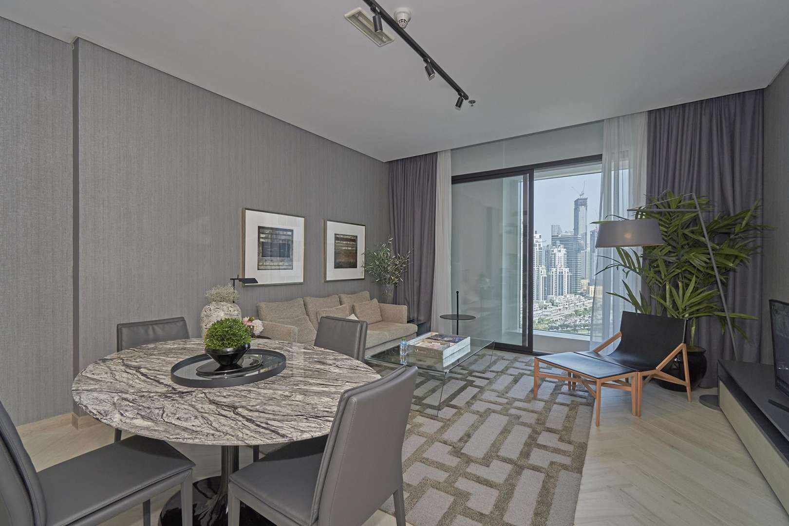 Modern studio apartment interior in Wilton Park Residences, MBR City, featuring open kitchen and living area