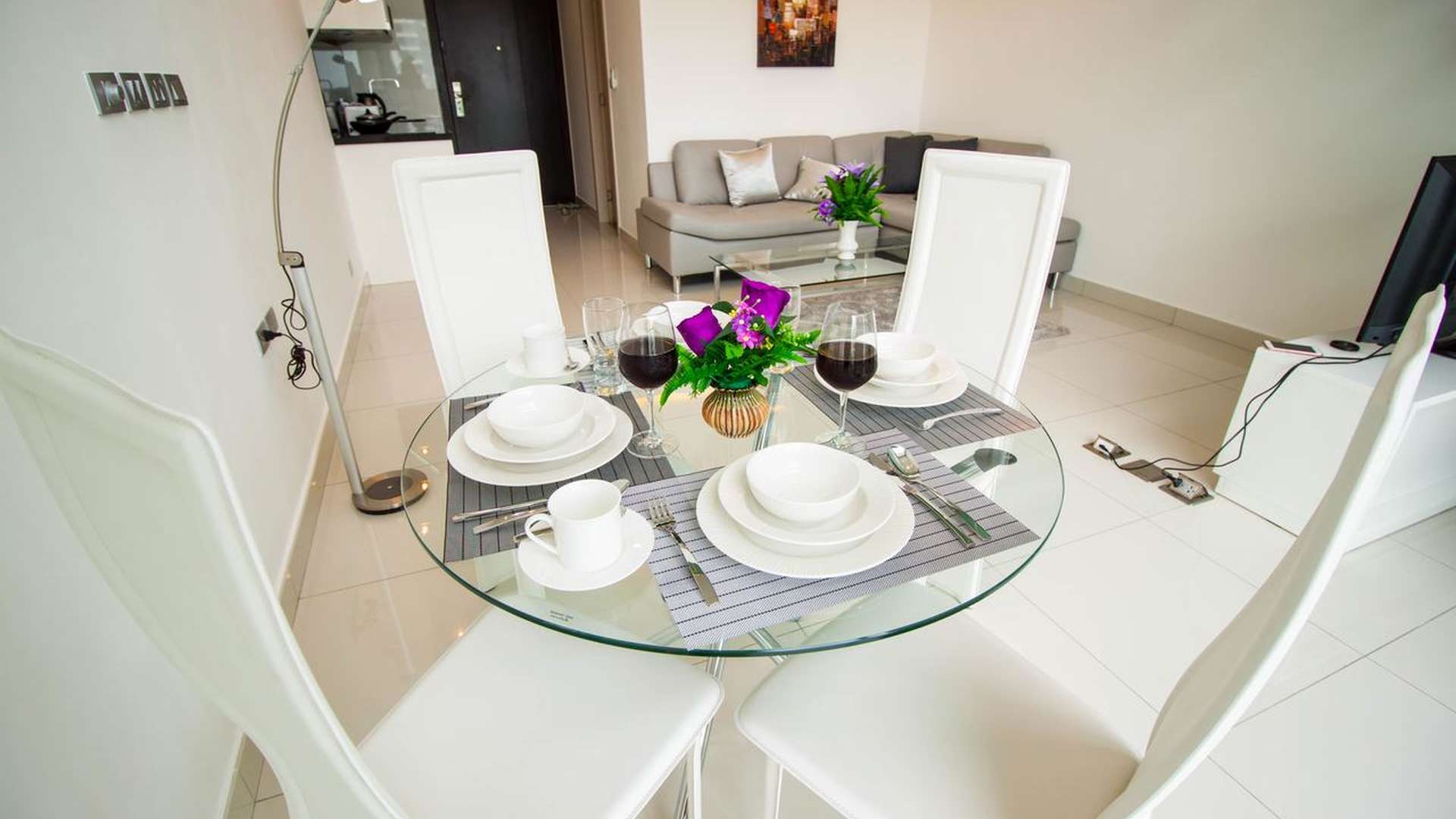 Dining area in Wong Amat Tower apartment, Pattaya, with modern decor and table setting