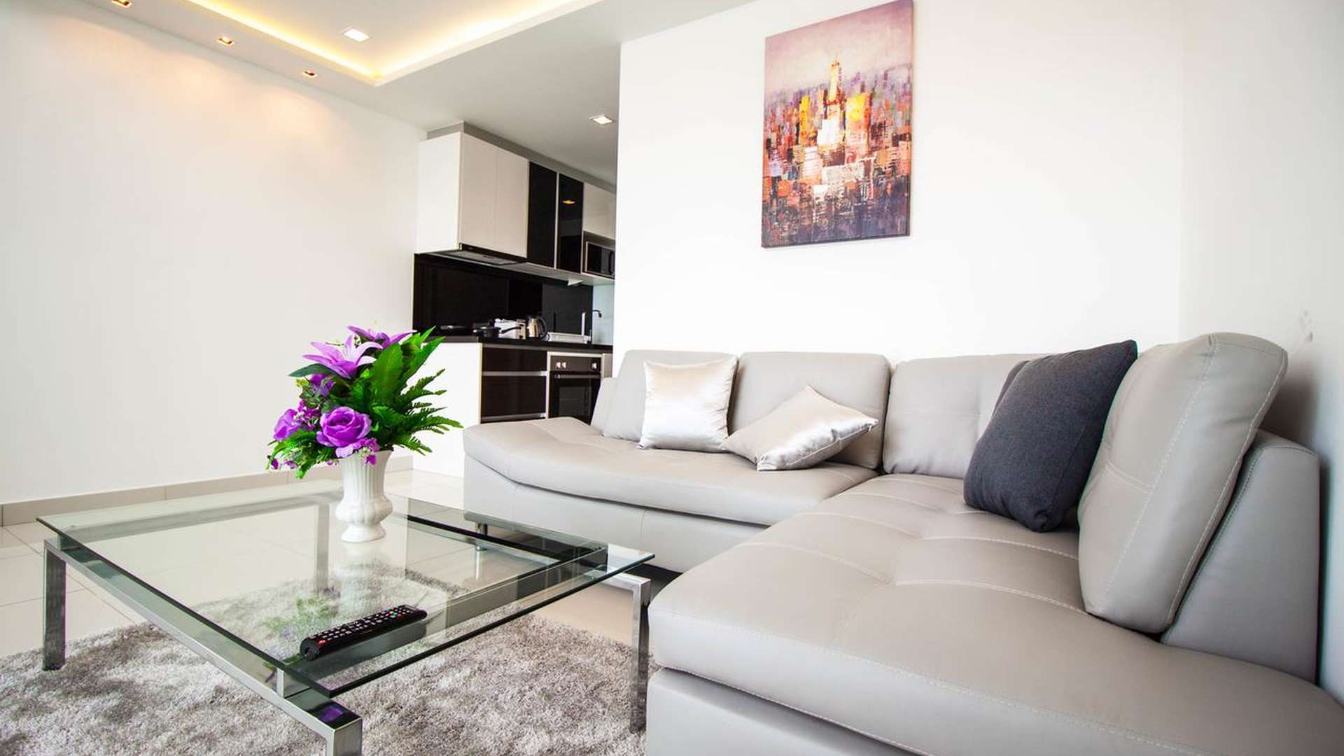 Modern living room in Wong Amat Tower apartment, Pattaya, with sleek staircase and decor